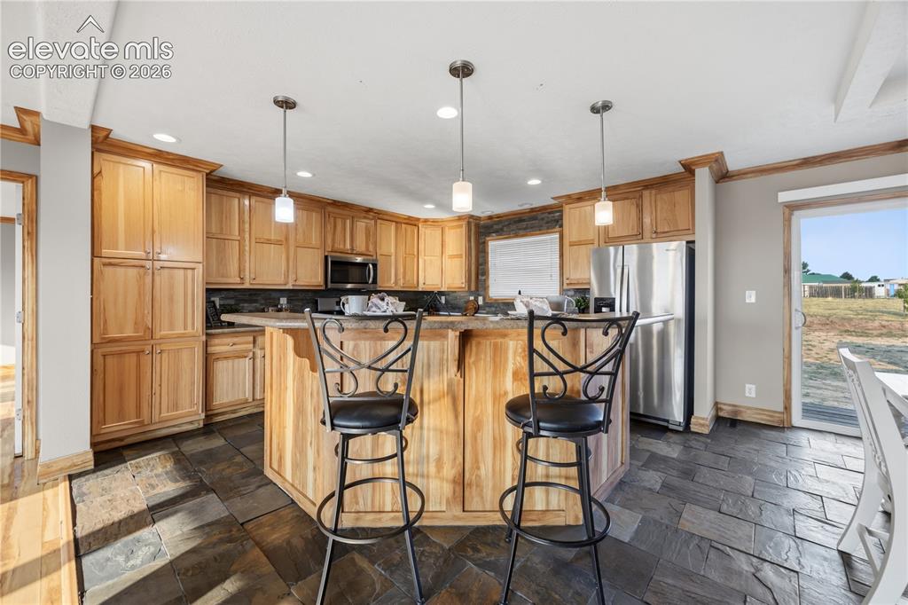 Image 13 of 49: Kitchen Island with breakfast bar