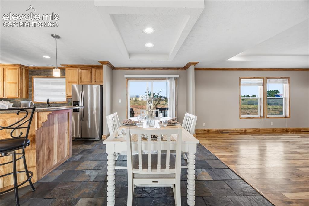 Image 14 of 49: next to the kitchen is a dining space