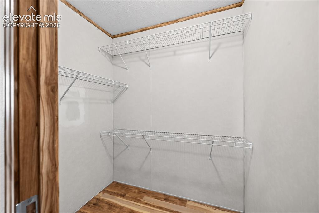 Image 22 of 49: Primary Bedroom Walk-In-Closet