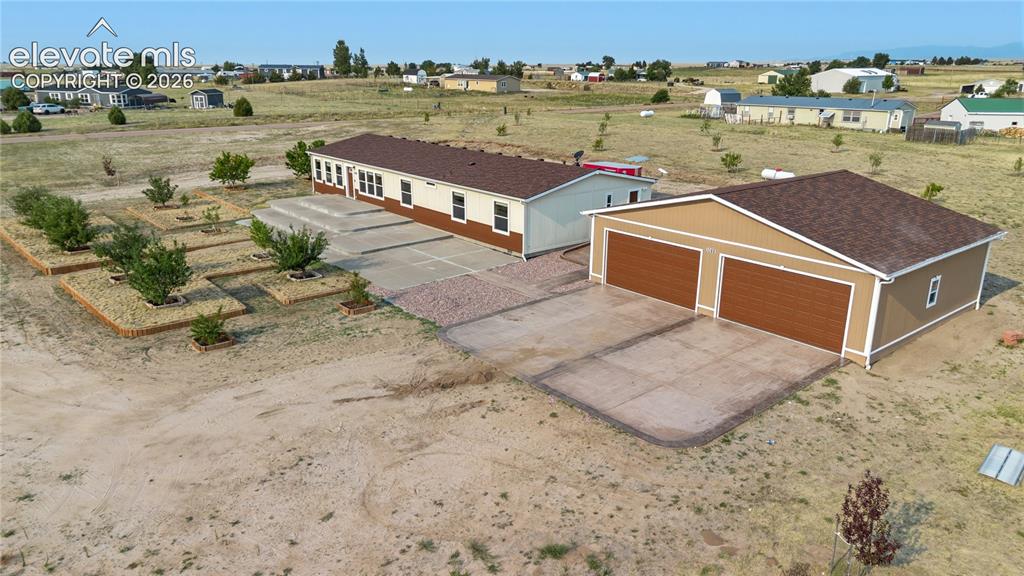 Image 3 of 49: Home has a 1200 SqFt Garage with two double doors in the front