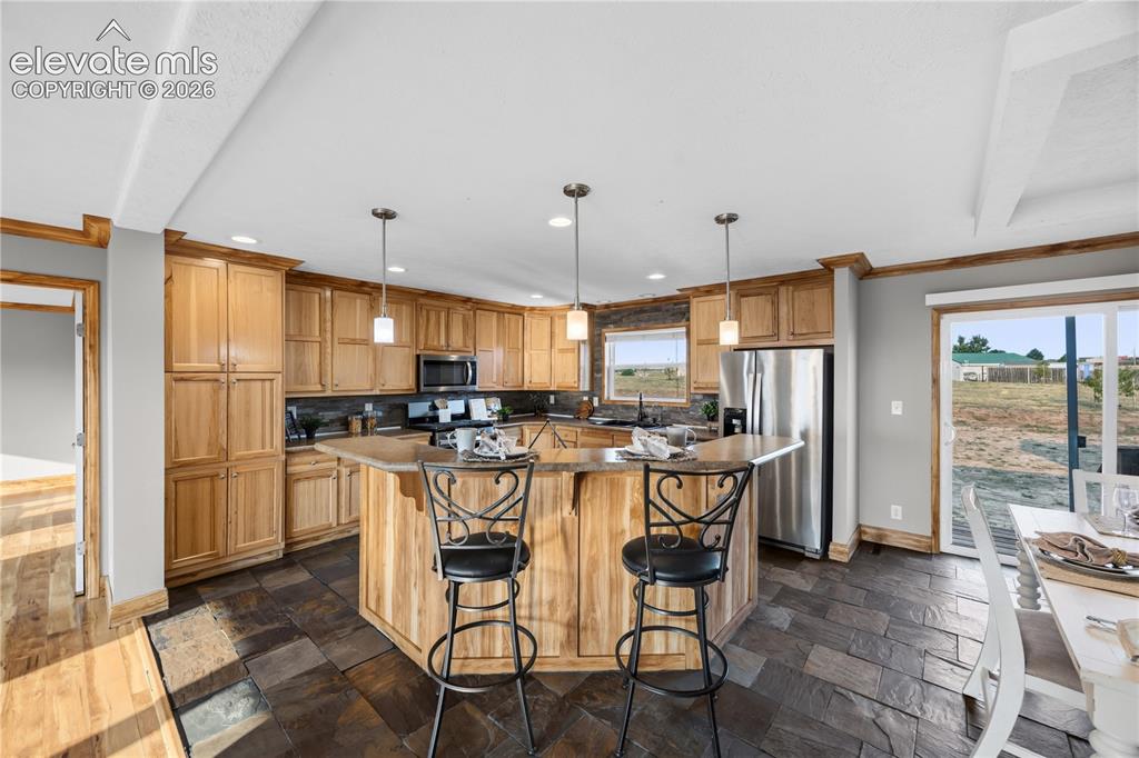 Image 9 of 49: Adjacent to the Living Room is the kitchen.