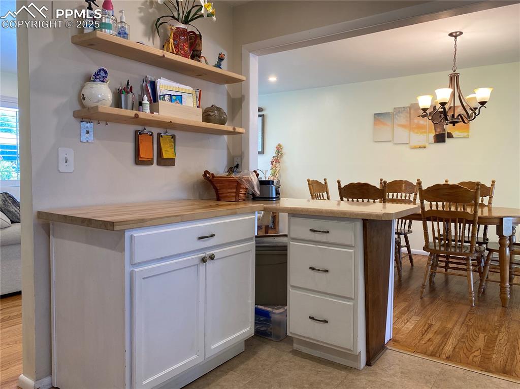 Image 14 of 35: Additional cabinets and countertop provide more versatility