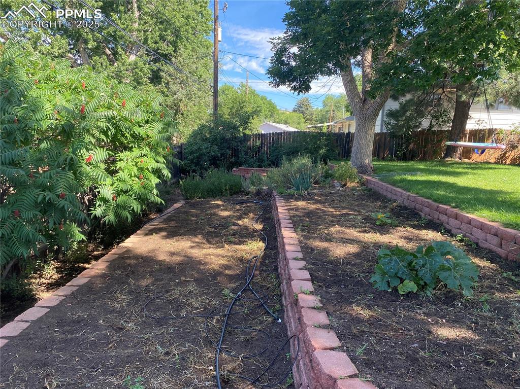 Image 31 of 35: With terraced garden beds, complete with drip line sprinklers