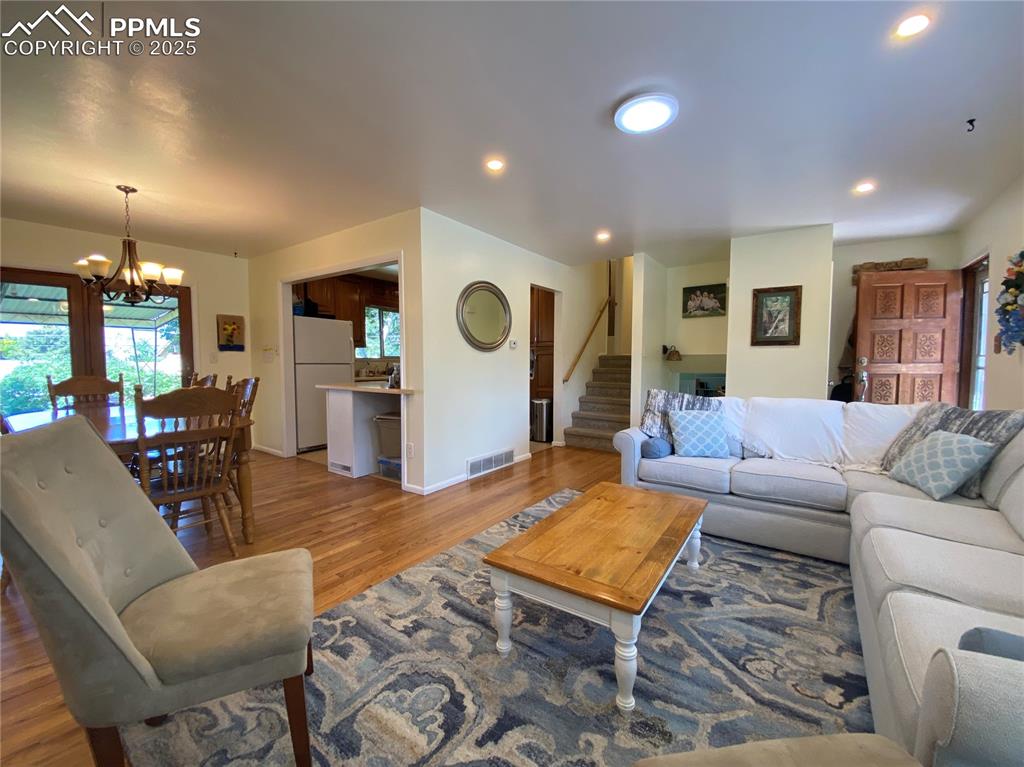 Image 4 of 35: The natural hardwood floors are stunning