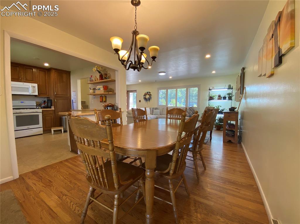 Image 5 of 35: And the dining room walks out to the covered porch