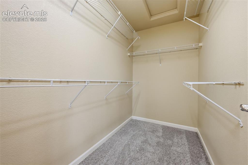 Image 14 of 23: Large master closet