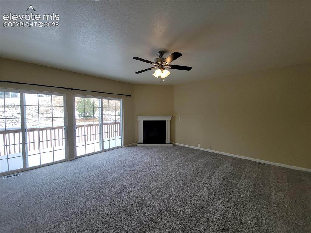 Image 5 of 19: Huge Living room with doors to back deck