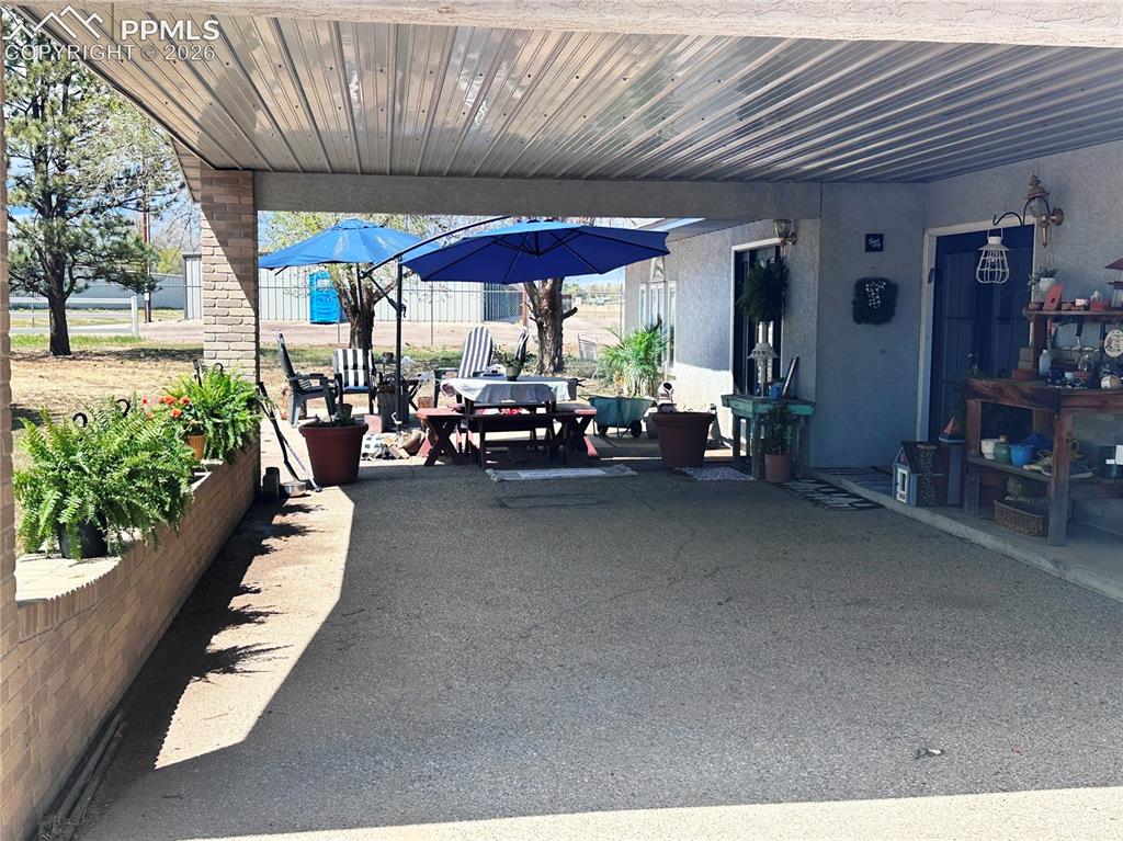 Image 10 of 48: Covered drive-under entry for loading or unloading, or handicap easy entry.