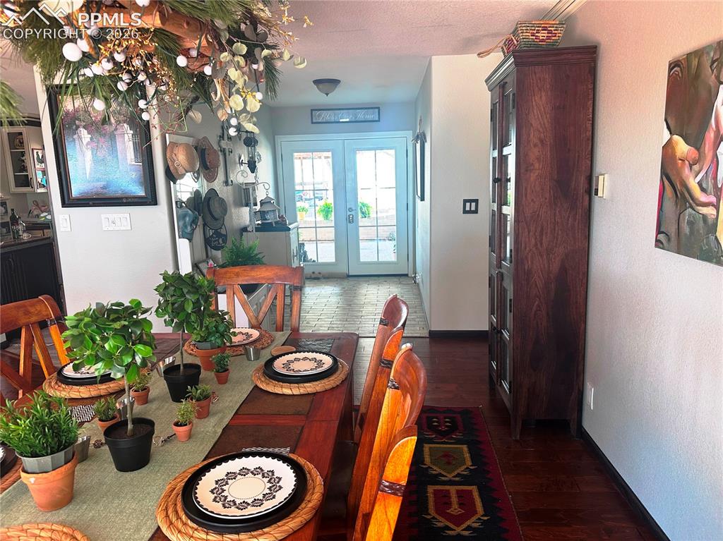 Image 15 of 48: Dining room showing tiled entry foyer.