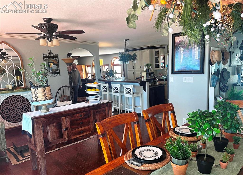 Image 16 of 48: View of sitting area at left, living room at top and kitchen area with brea