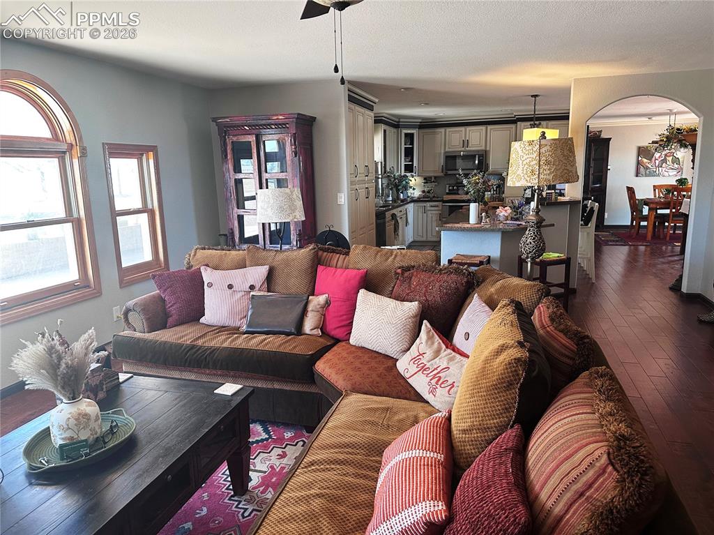 Image 26 of 48: Living room is west facing and kitchen and dining areas adjoin in this open