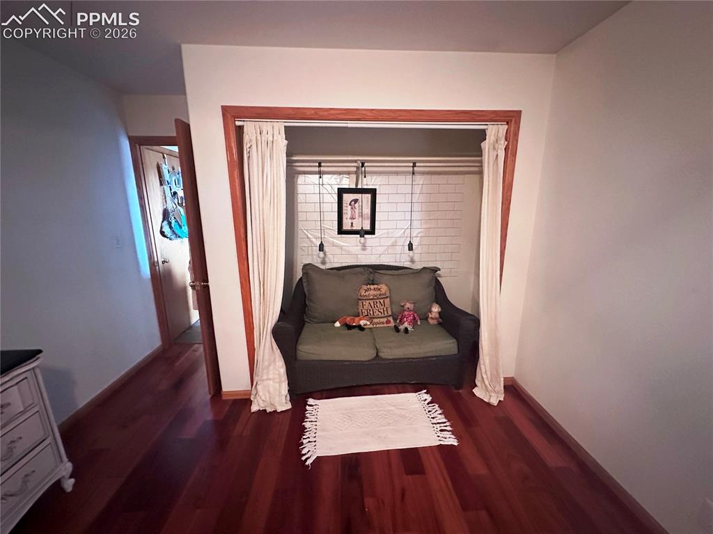 Image 38 of 48: Bedroom 3, with closet presently used as sitting area for visiting overnigh