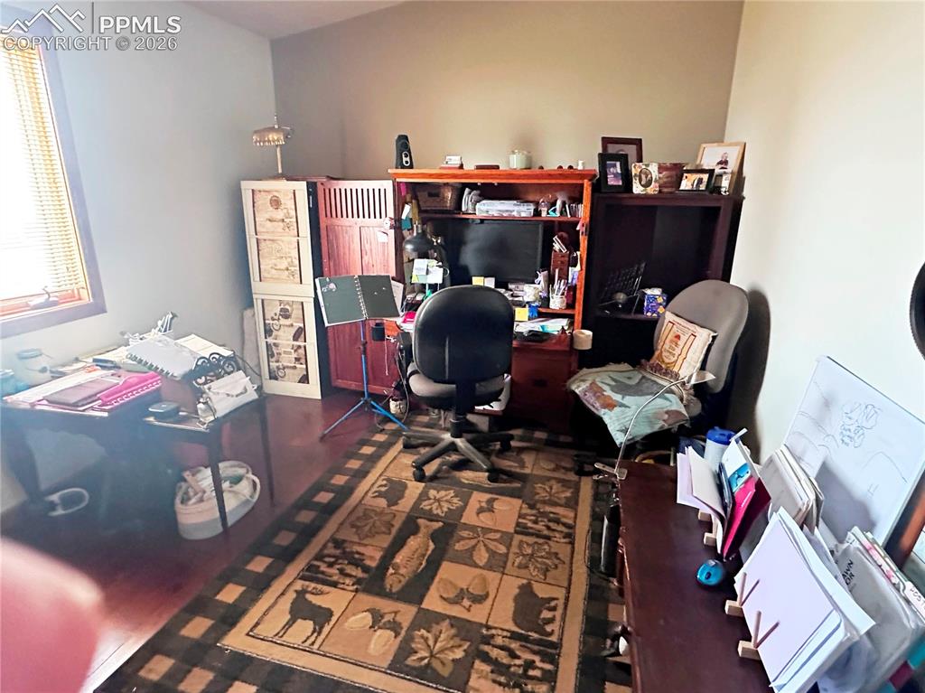 Image 39 of 48: Bedroom 4, currently used as an office.
