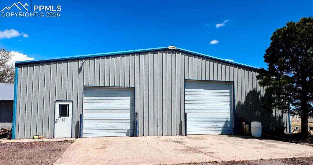 Image 4 of 48: This shows the two overhead doors as well as the people door, which allowed