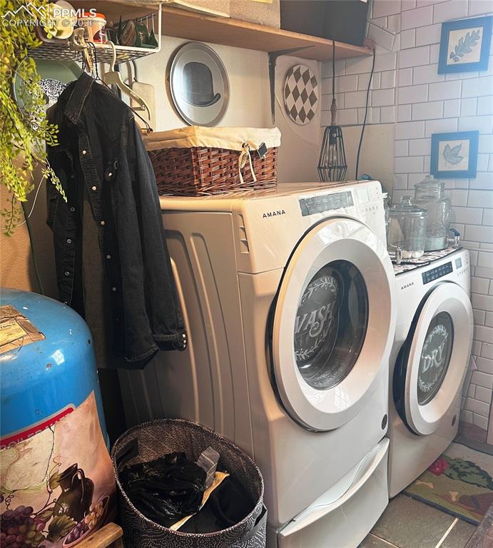 Image 41 of 48: Washer and Dryer included with home.