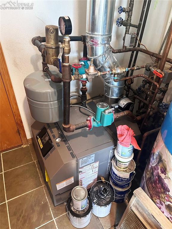 Image 42 of 48: This shows the very new boiler and pump for the under floor hot water radia
