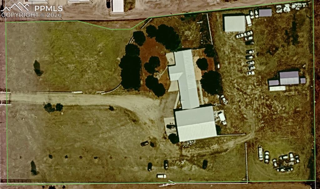 Image 48 of 48: Aerial view of property. Cars in back are gone.