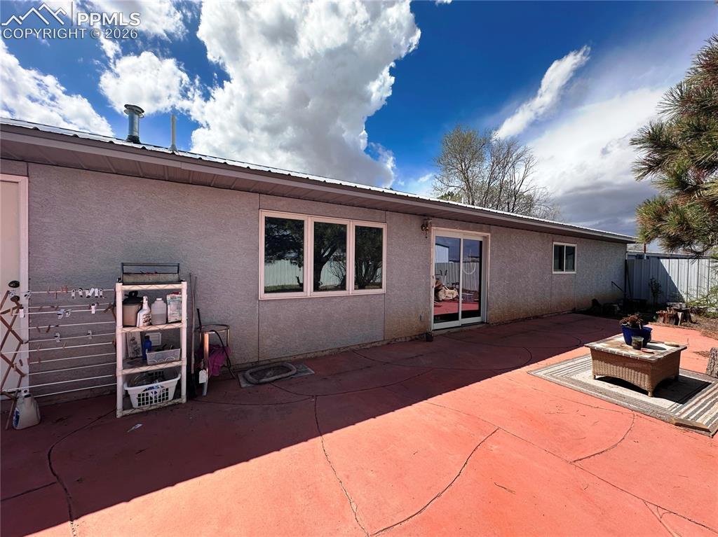 Image 6 of 48: Backyard with huge stamped concrete patio.