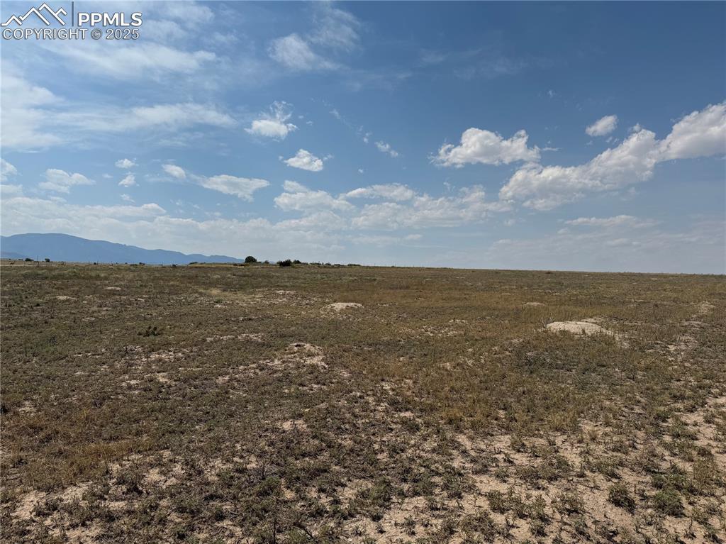 Image 11 of 17: View of nature with a mountain backdrop