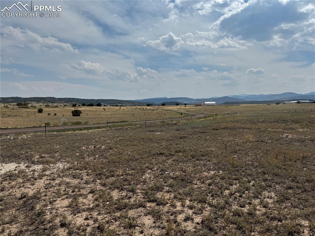 Image 12 of 17: View of yard featuring a rural view and a mountain view