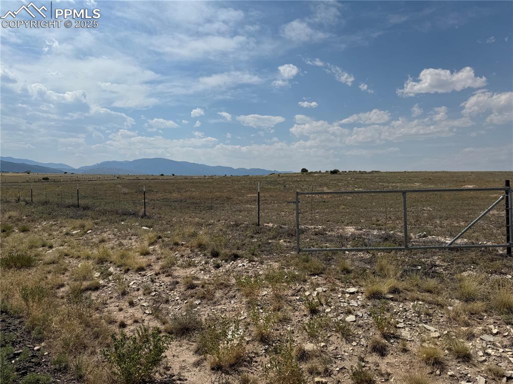 Image 14 of 17: View of mountain backdrop with rural landscape