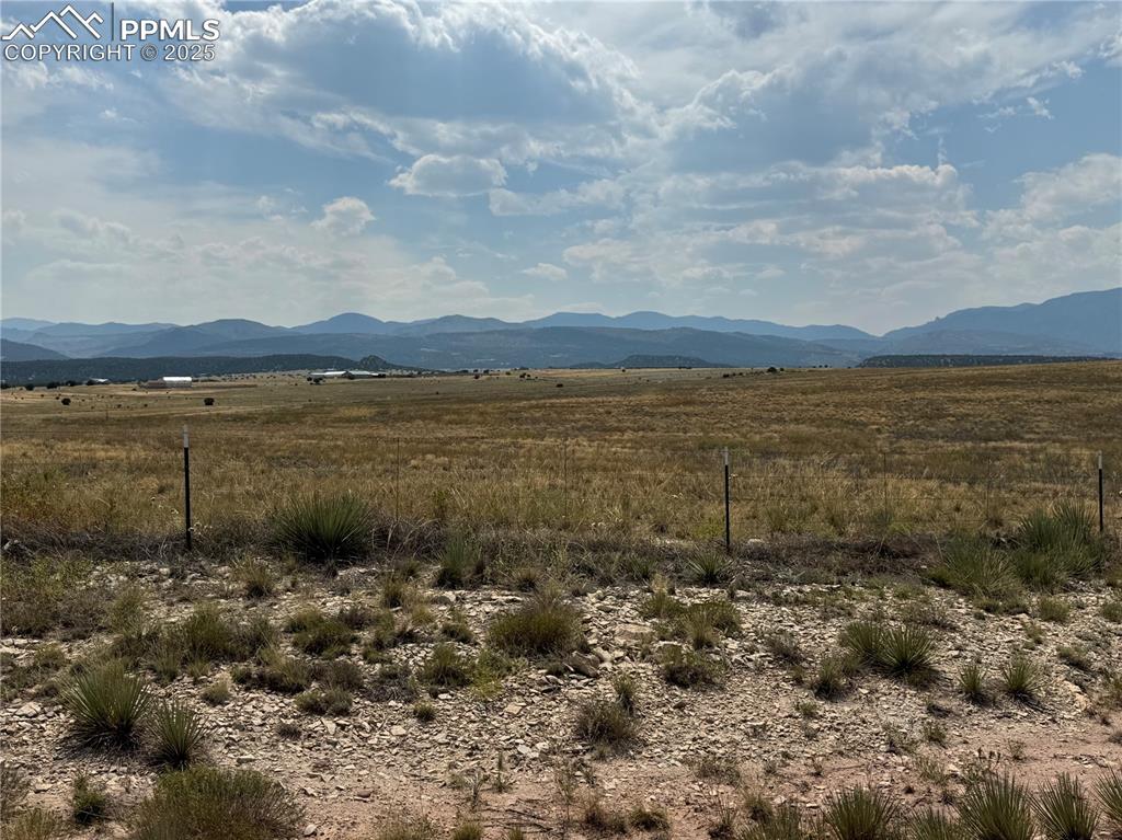 Image 3 of 17: View of mountain backdrop with rural landscape