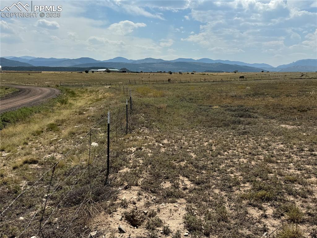 Image 4 of 17: View of mountain background featuring rural landscape
