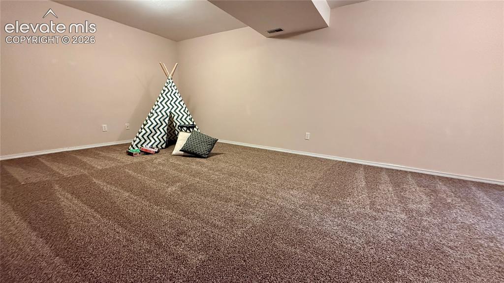 Image 17 of 26: Large room in the basement...can be rec room, family room kids play area...