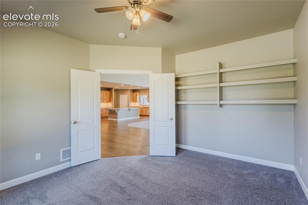 Image 11 of 50: Office with shelving