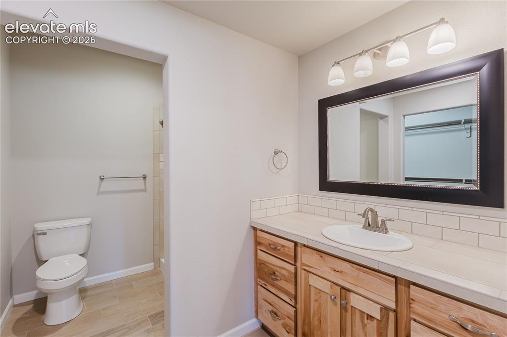Image 40 of 50: Attached bath to basement bedroom