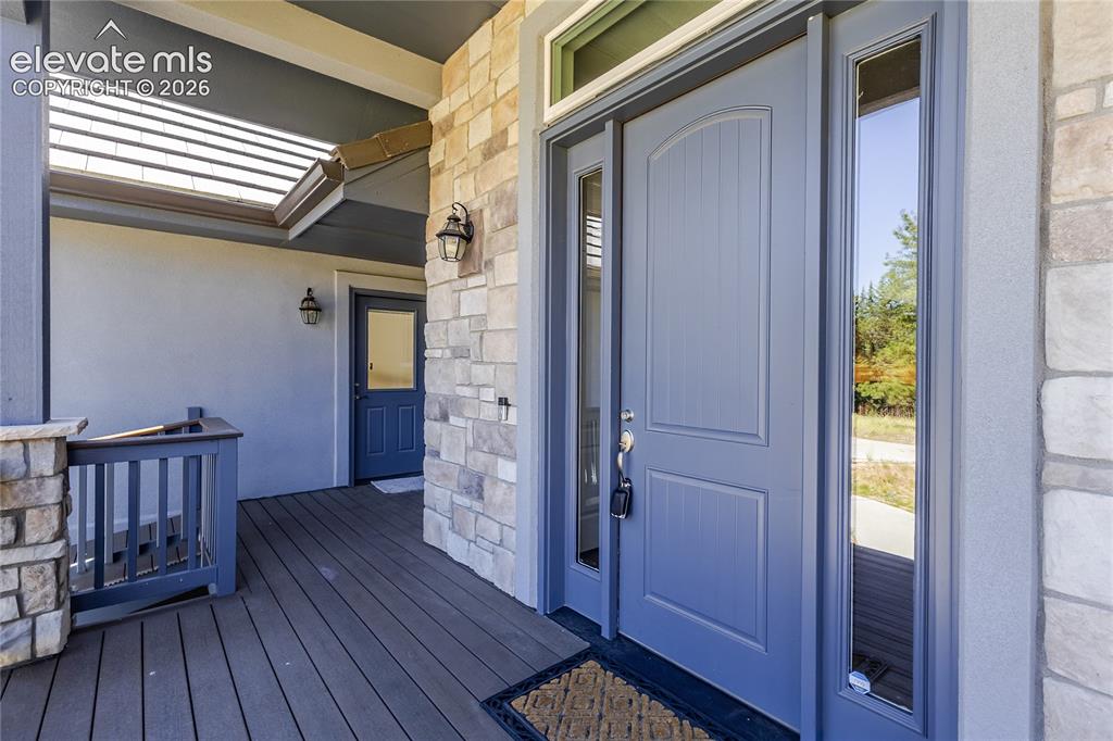 Image 5 of 50: Front door and door to garage.
