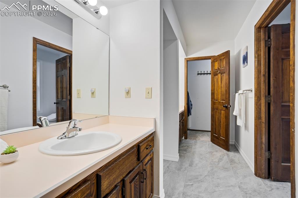 Image 17 of 50: Dual Vanities and Closets