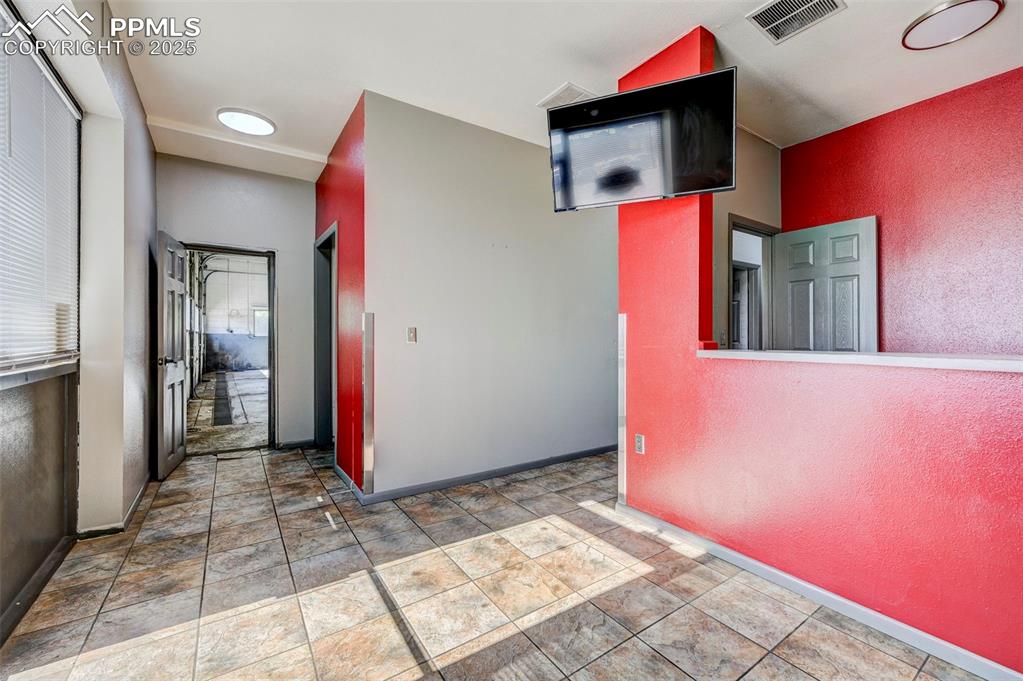Image 27 of 42: Hall with stone finish flooring