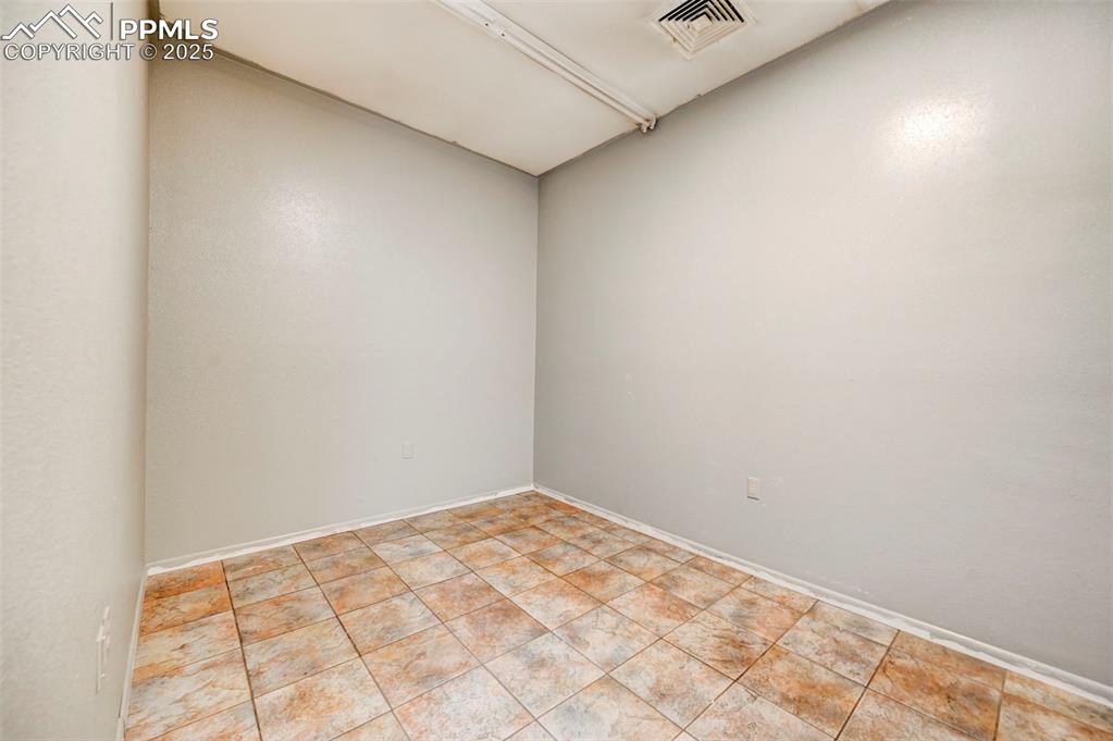 Image 32 of 42: Unfurnished room featuring baseboards