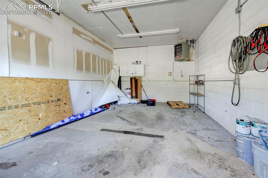 Image 40 of 42: Garage featuring a heating unit