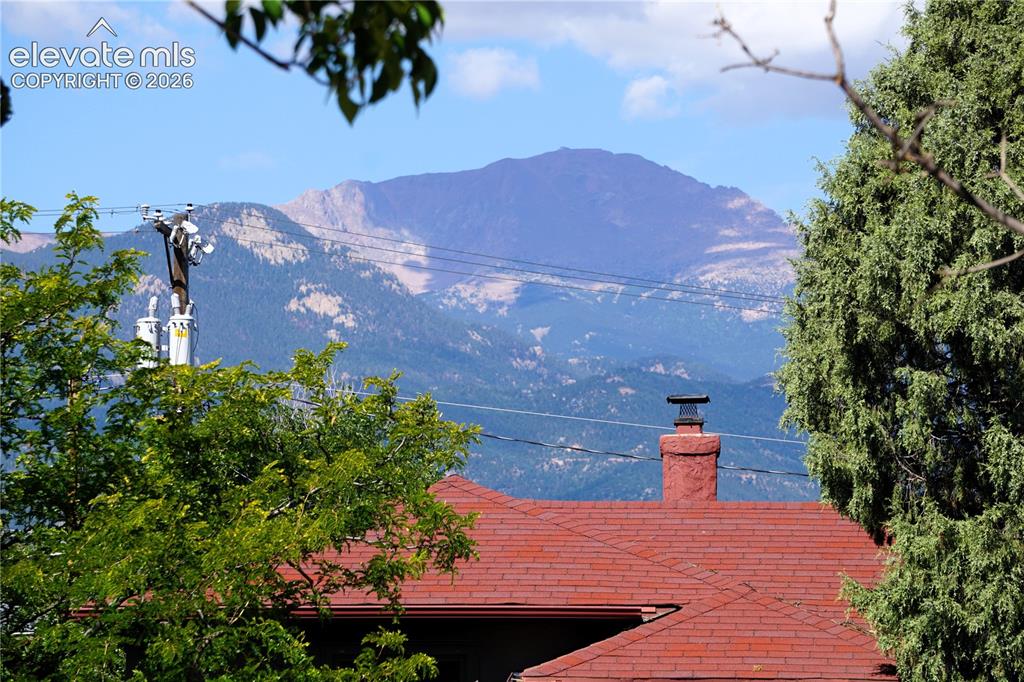 Image 9 of 39: Pikes Peak Views from Front door and living room.
