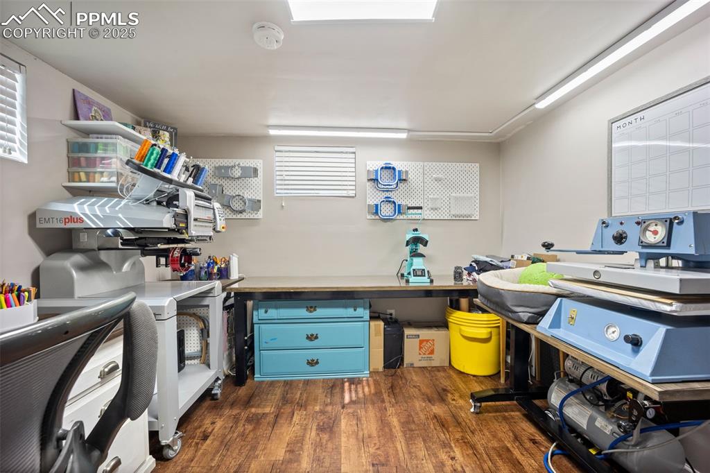 Image 22 of 47: Office with dark wood-style flooring