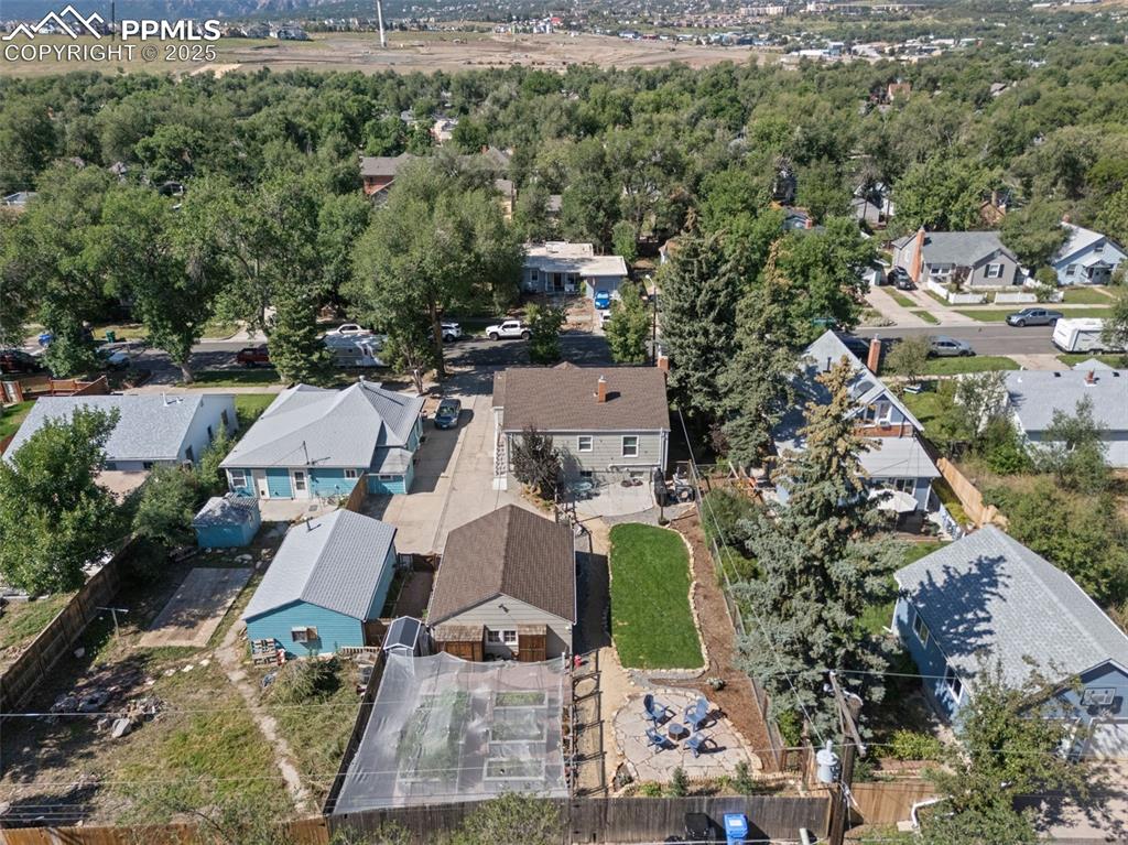 Image 45 of 47: Aerial view of property and surrounding area featuring nearby suburban area