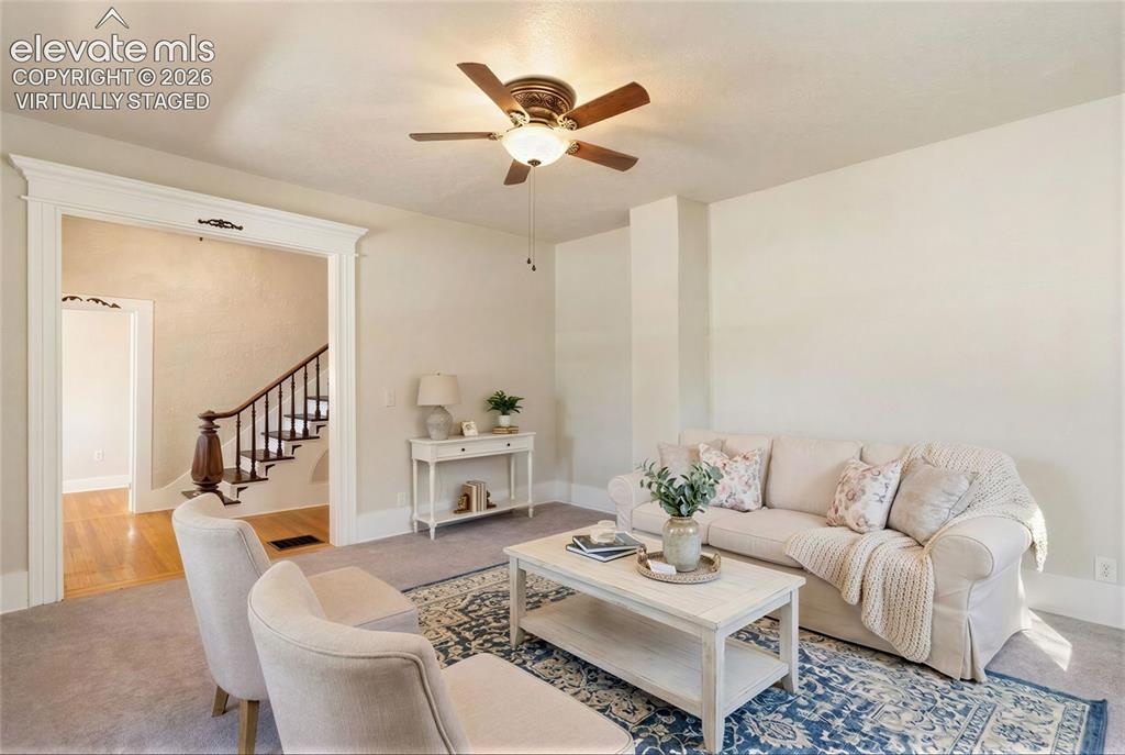 Image 7 of 42: Virtually staged ceiling fan with integrated lighting