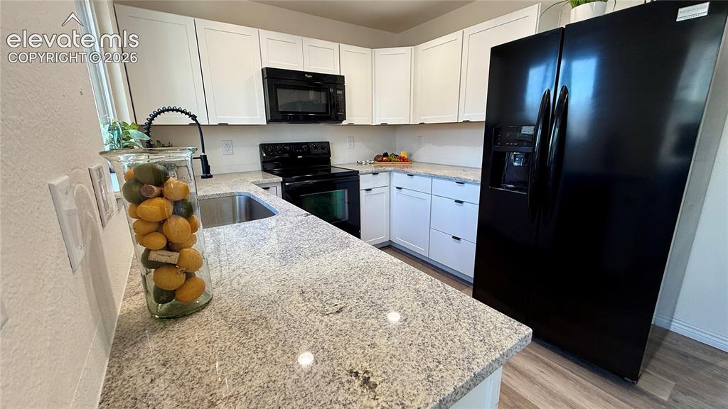 Image 8 of 22: New cabinets, countertops and faucet