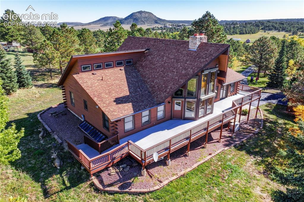 Image 1 of 45: View of subject property featuring a mountain backdrop