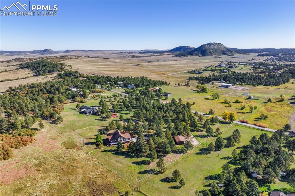 Image 42 of 45: View of rural area featuring a mountain backdrop
