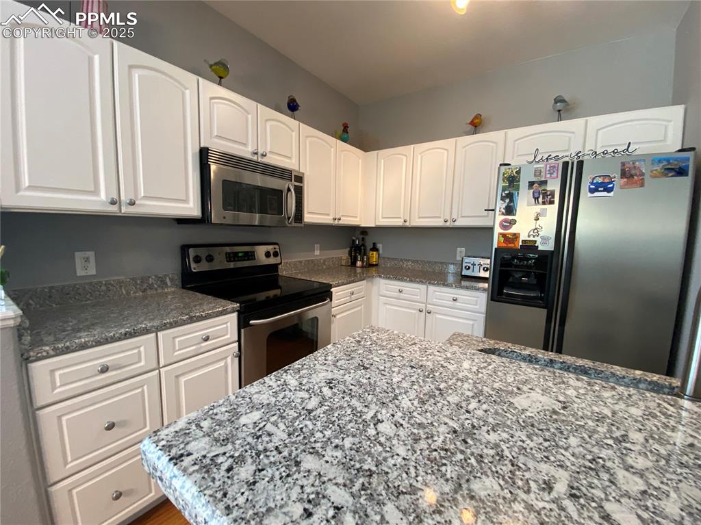 Image 19 of 41: This dining area provides a bright, functional space