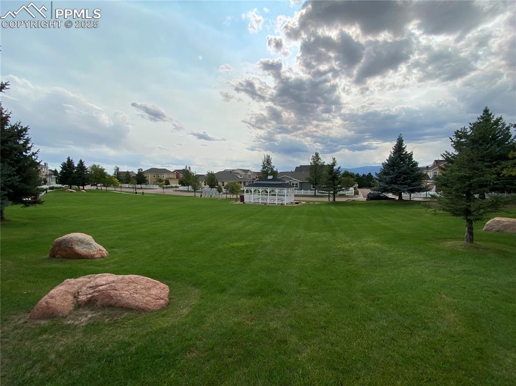 Image 9 of 41: The community’s green spaces and parks create ideal areas for recreation, r