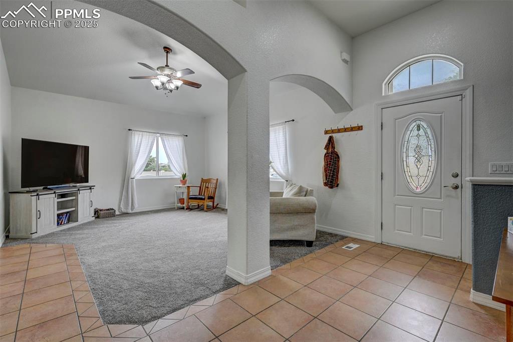 Image 10 of 47: Entryway featuring healthy amount of natural light, light tile patterned fl