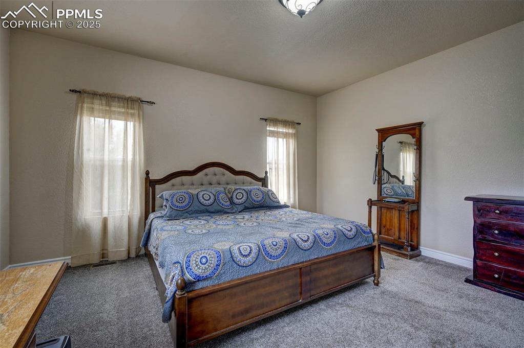 Image 21 of 47: Bedroom with carpet and baseboards
