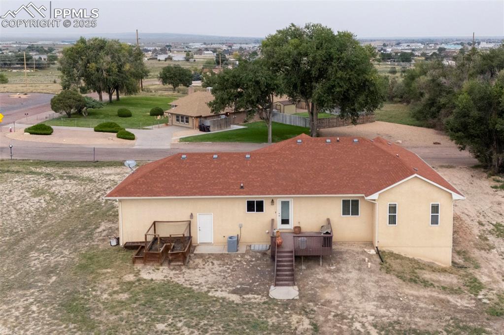 Image 42 of 47: Rear view of property with stucco siding, stairs, and a deck