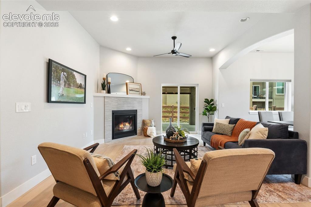 Image 24 of 43: Spacious room featuring light wood-finish flooring and a ceiling fan