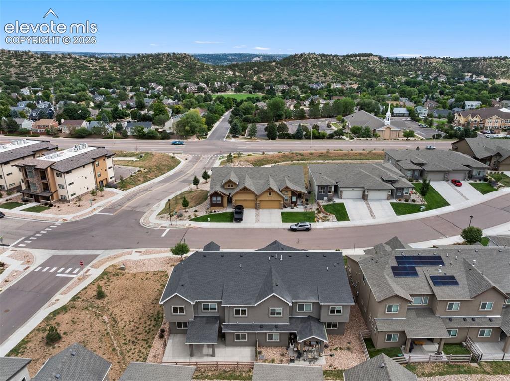 Image 6 of 43: Residential development featuring a variety of architectural styles, paved
