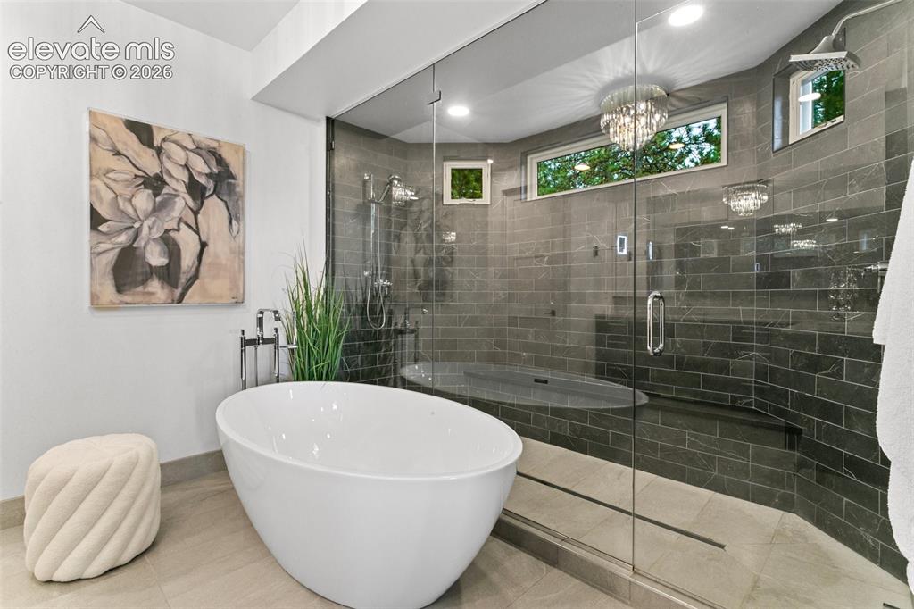 Image 21 of 49: Primary bath and Double shower